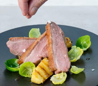 duck breasts cooked with charred pineapple 
