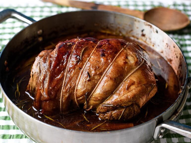 Photograph of 5 Hour leg of lamb with rosemary, shallots & garlic