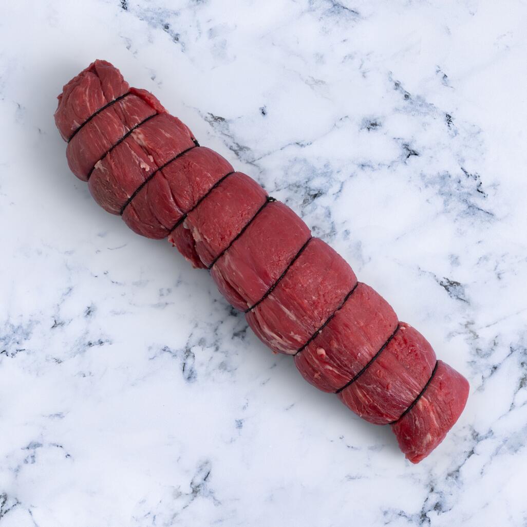 whole beef fillet on marble background 