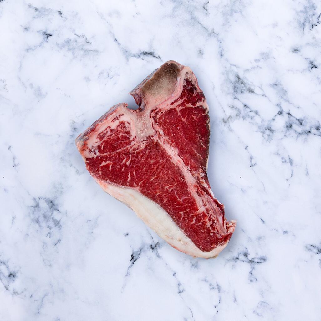 t bone steak on marble background