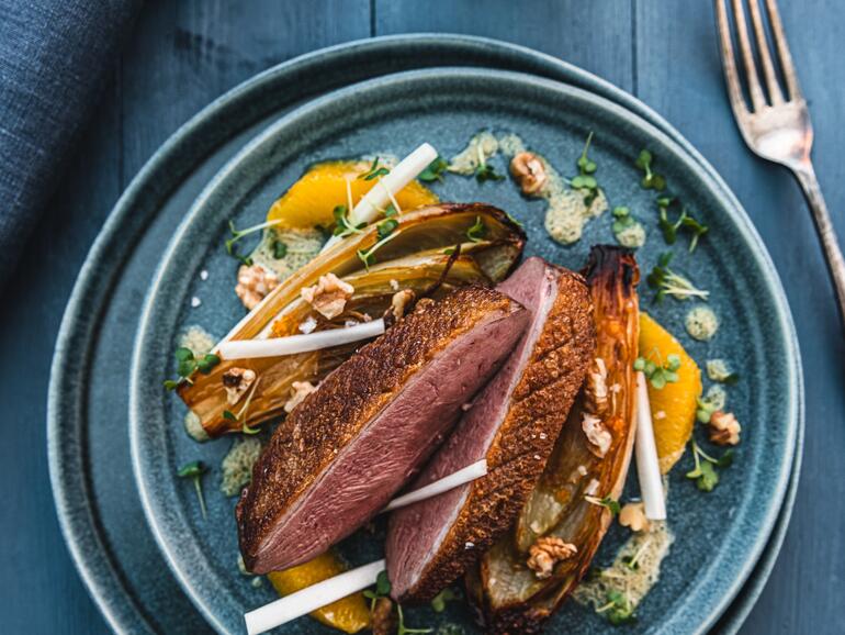 roasted duck steak with chicory & walnut vinaigrette