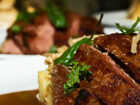 cooked rib eye steak with sauce 