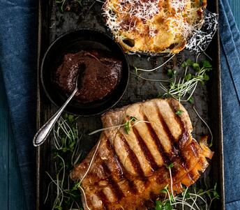 cooked pork chop, parsnip gratin & prune ketchup