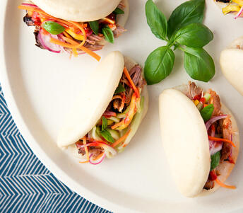pulled pork with hirata buns and asian style pickles cooked