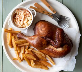 half roast chicken with chips, coleslaw and homemade mayonnaise cooked