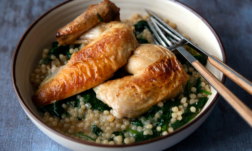 roast spring chicken (poussin) with giant couscous cooked