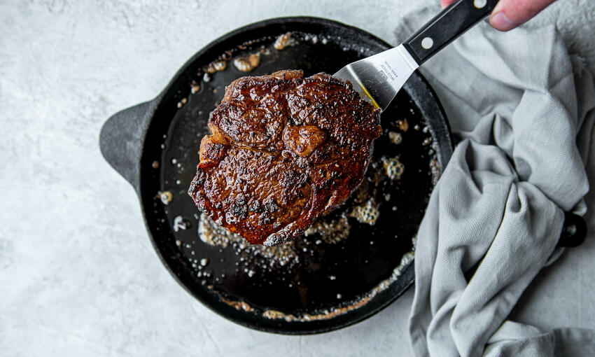 coffee rubbed rib eye steak & bourbon sauce cooked