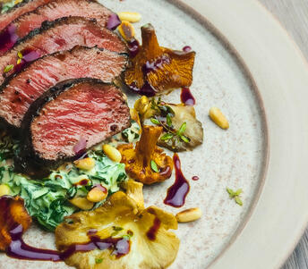 garlic-marinated haunch of venison cooked