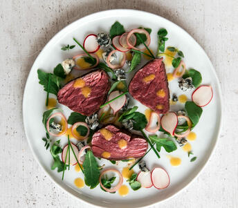 salad of beef fillet medallions, blue cheese & pickled shallot