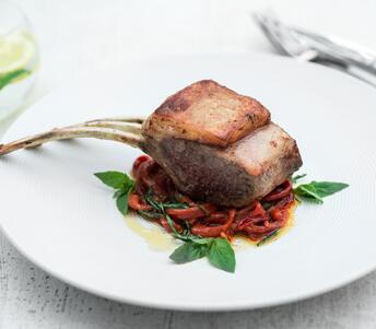 lamb rack cooked with sweet pepppers and basil 