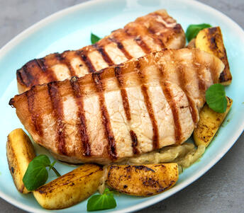 pork loin steak cooked with mustard apples and onion 