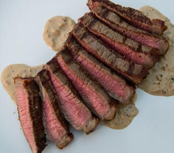 rump steak with peppercorn sauce cooked 