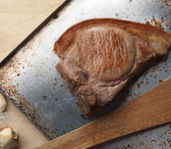 roasted old spot pork t-bone chops with cider and garlic